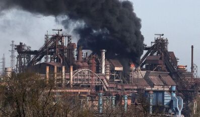 Smoke rises above a plant of Azovstal Iron and Steel Works during Ukraine-Russia